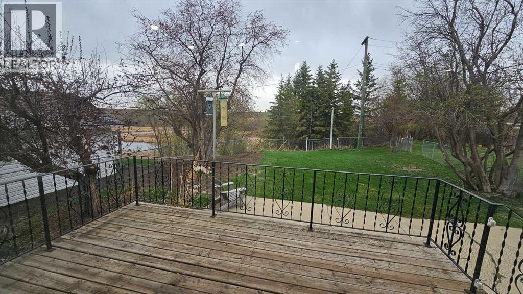 deck and fenced back yard