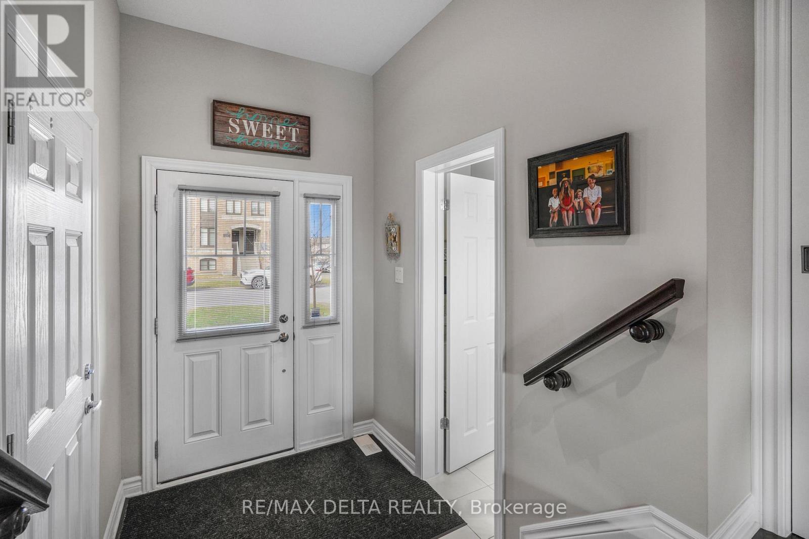 Sunken foyer with access to garage & powder bath.