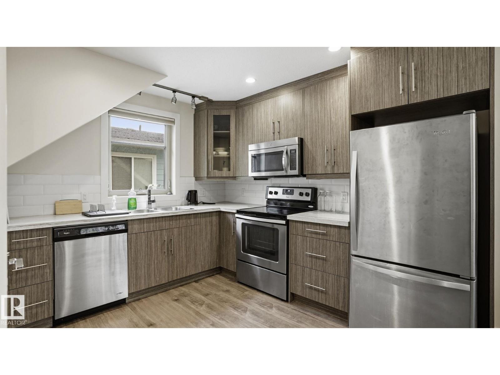 11002 University AV NW - 55