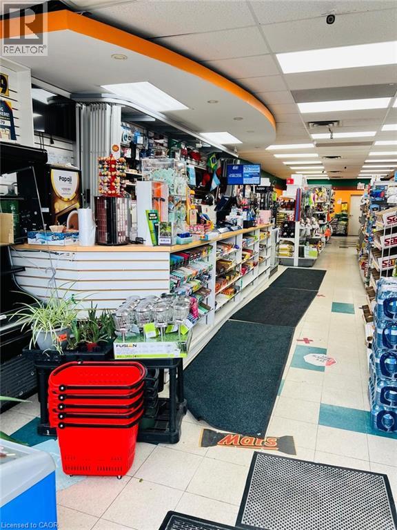Retail interior with recessed lighting, drop ceiling, and tiled flooring