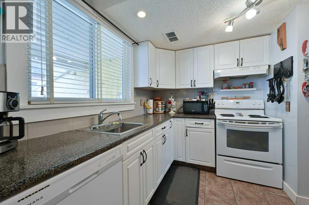 #5 7740 Hunterview Drive NW - 7