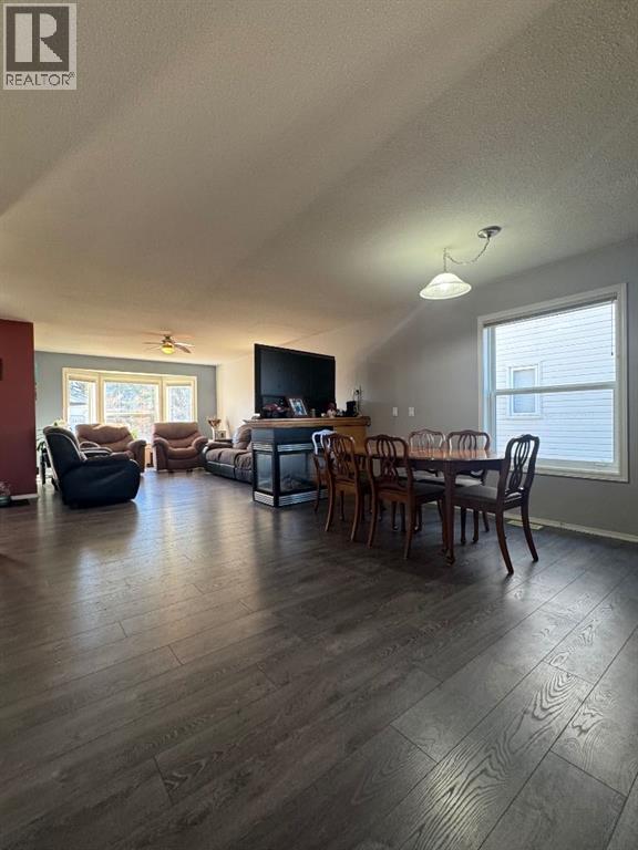 Dining Room & Living Room w/ Centre Gas Fireplace