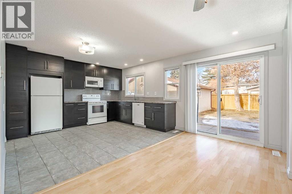 renovated kitchen 5 years ago, patio door to large patio at the private backyard