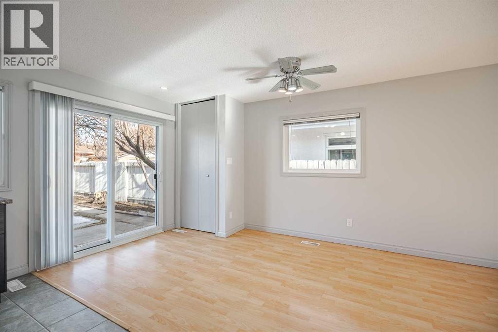 bright dining room , patio door direct to private backyard