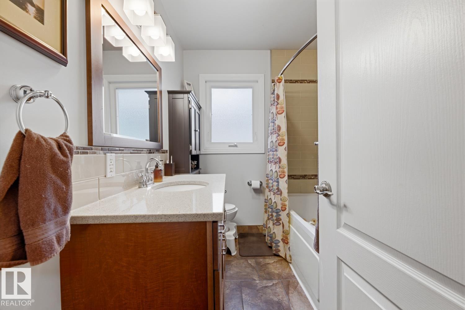 8754 STRATHEARN DR NW NW - 21