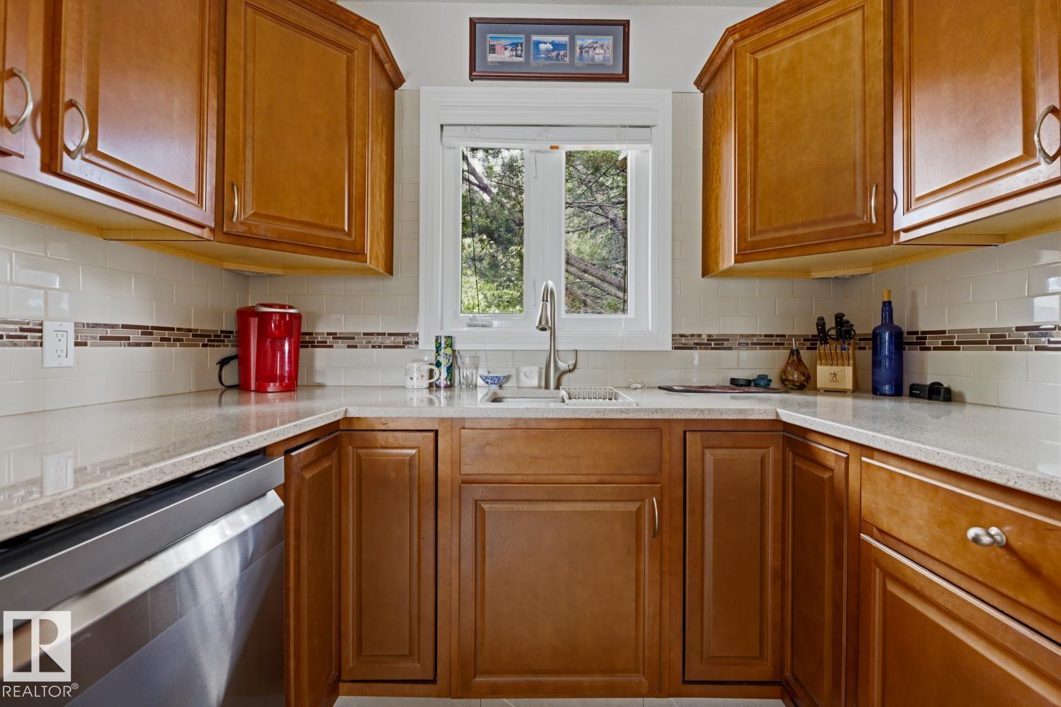 8754 STRATHEARN DR NW NW - 9