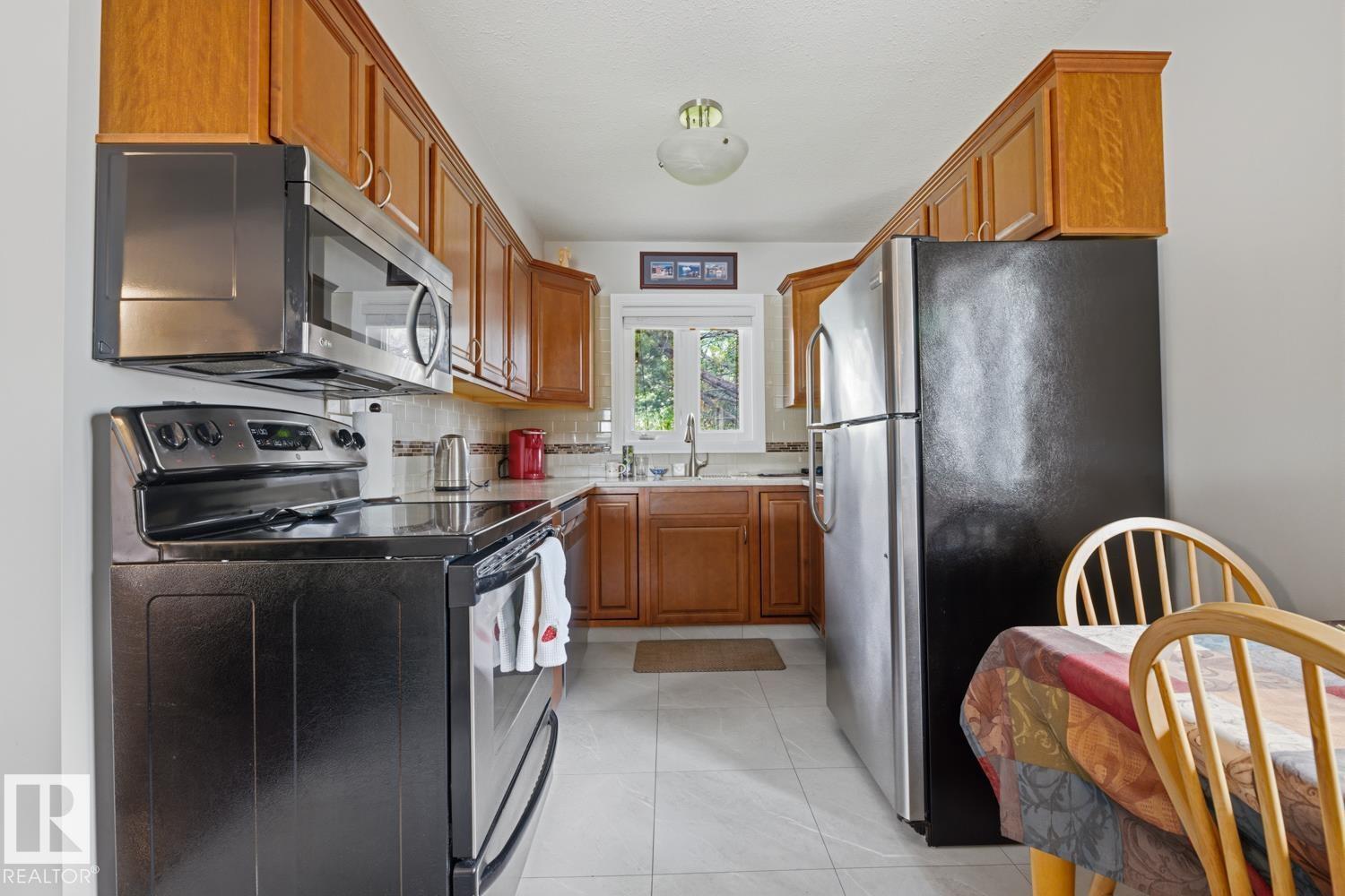 8754 STRATHEARN DR NW NW - 12