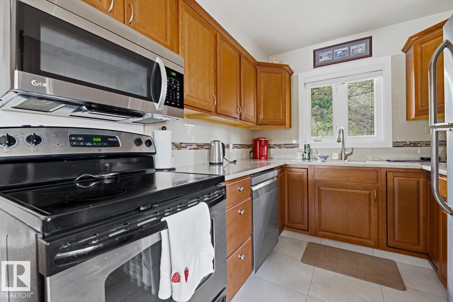 8754 STRATHEARN DR NW NW - 11