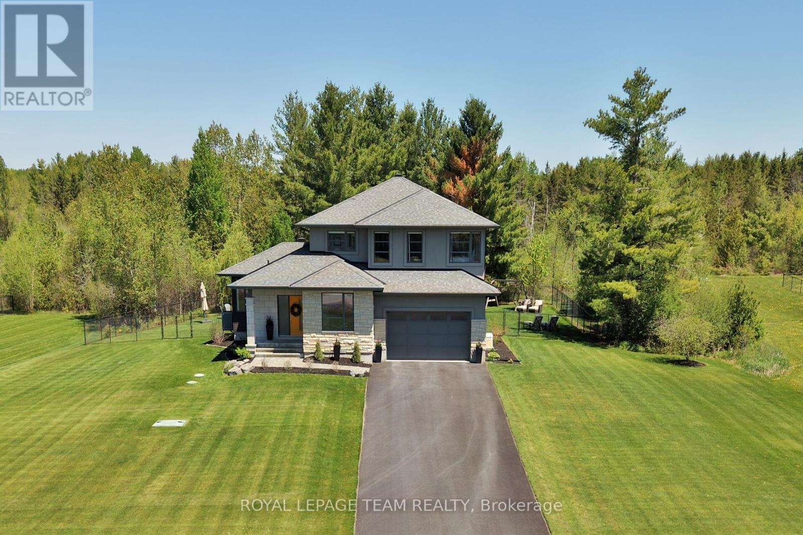 Stunning curb appeal w/stone & stucco ext