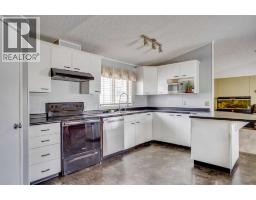 Living room - 209 Waterhouse Street, Fort Mcmurray, AB T9K2T1 Photo 8