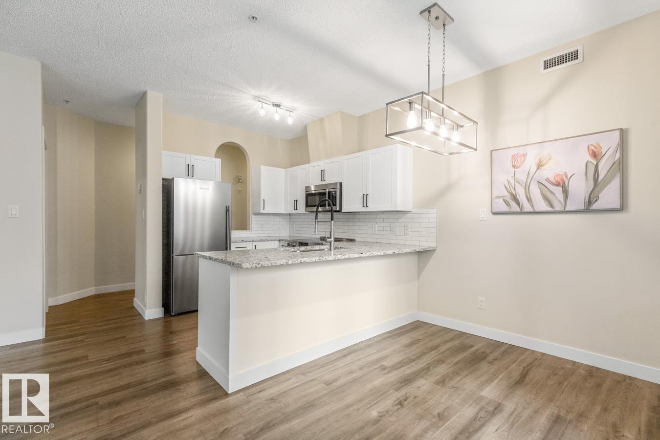 #101 8488 111 ST NW - 12