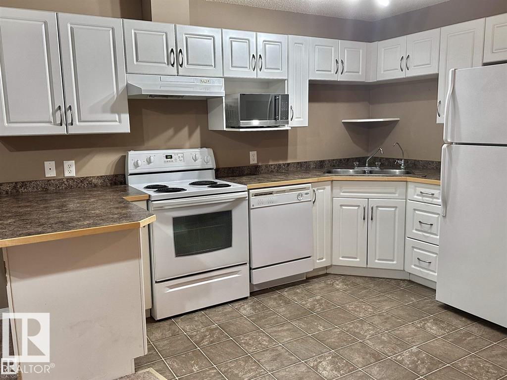 #115 3425 19 ST NW - 4