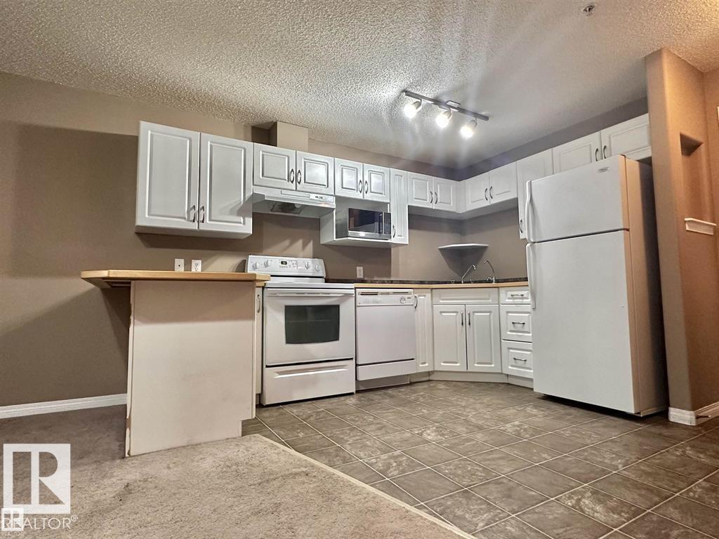 #115 3425 19 ST NW - 5