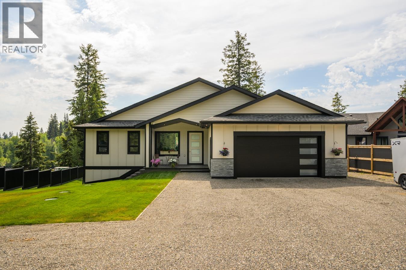 Primary bedroom of 27735 N NESS LAKE ROAD · Prince George, BC