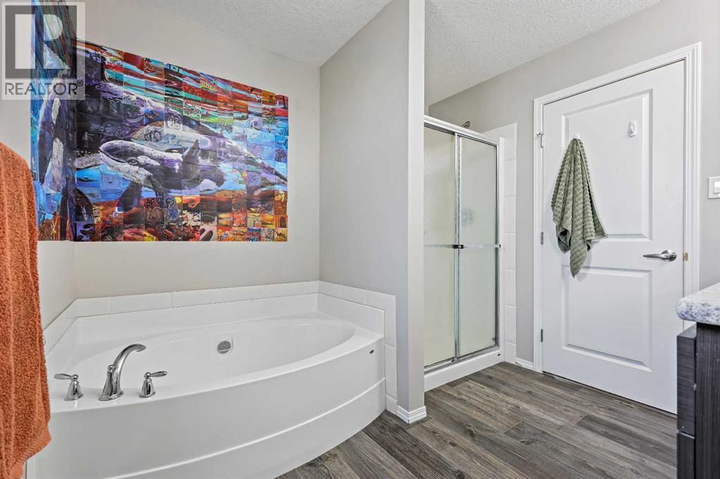 Primary bathroom with separate tub and shower