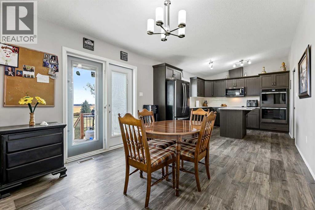Dining area with backyard access, flows to kitchen