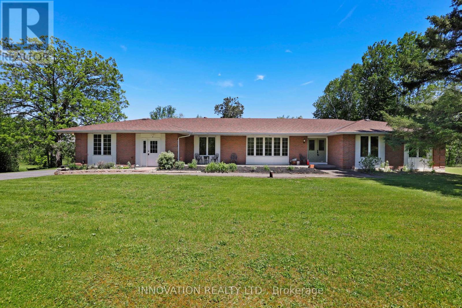 Sprawling brick bungalow on private 5 acres