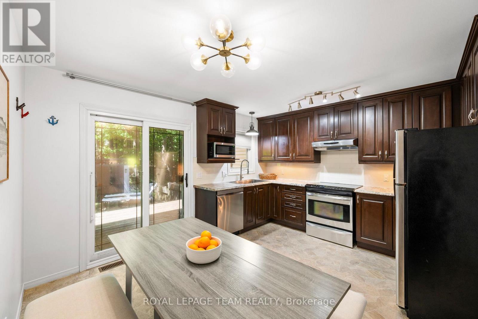 Bright eat-in kitchen with access to back deck and