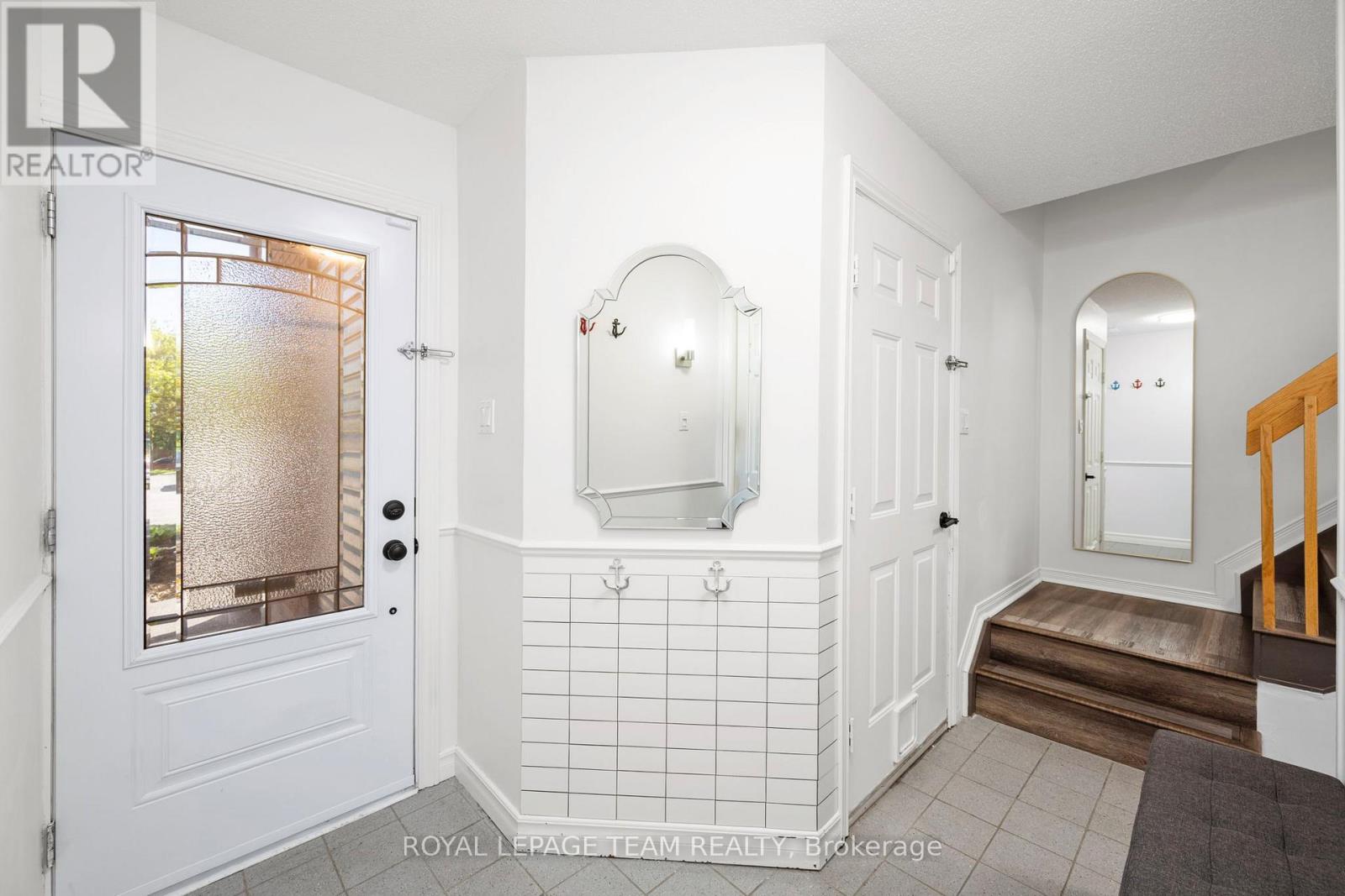 foyer with closet and garage access