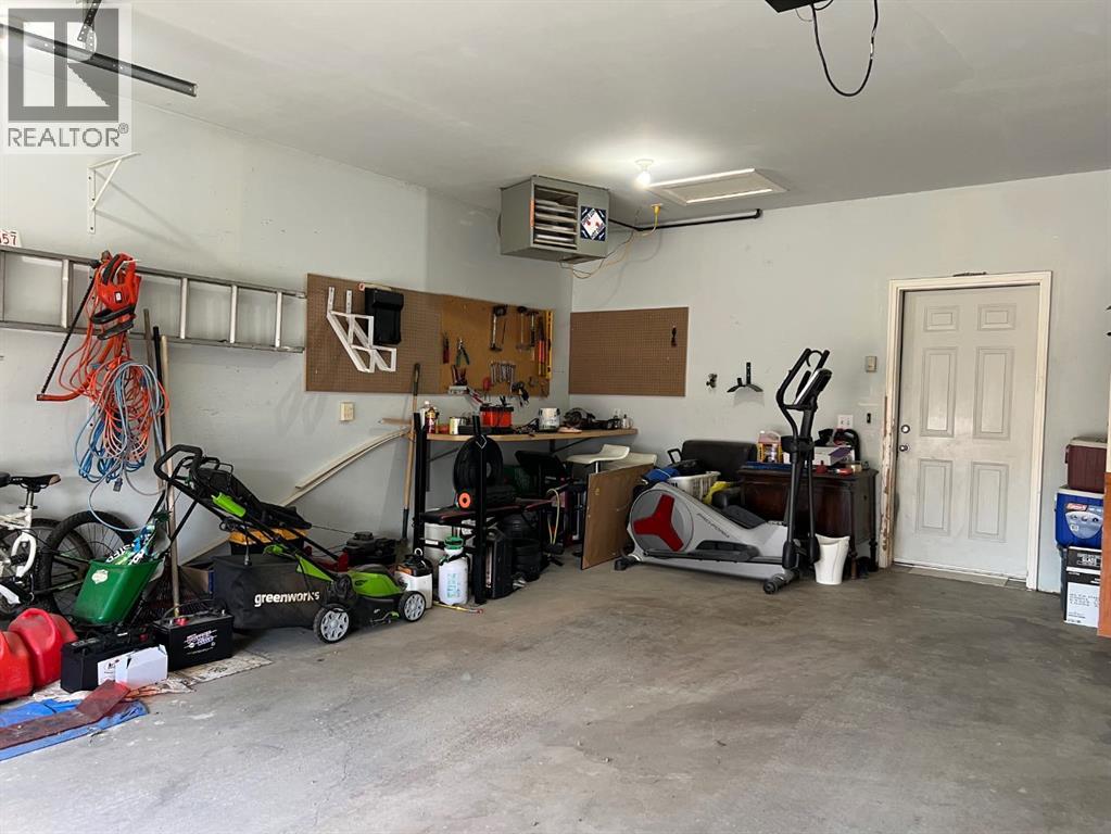 Garage is 23’2” by 23’6” inside, with an overhead heater