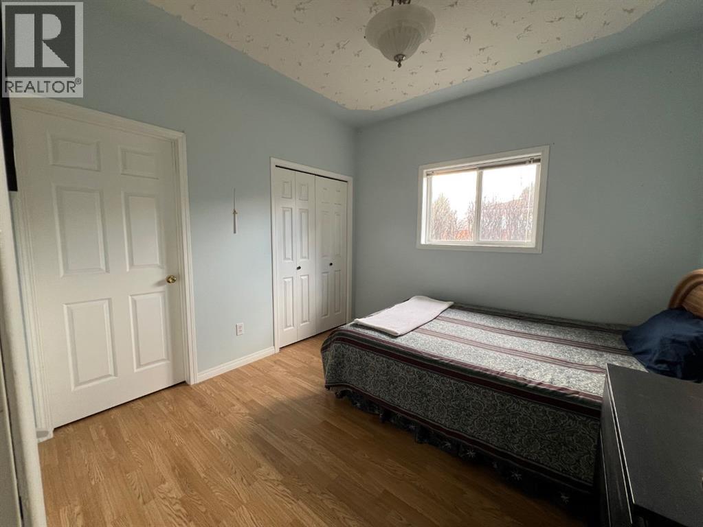 Bedroom 2 with a standard closet and a Walk-In Storage room