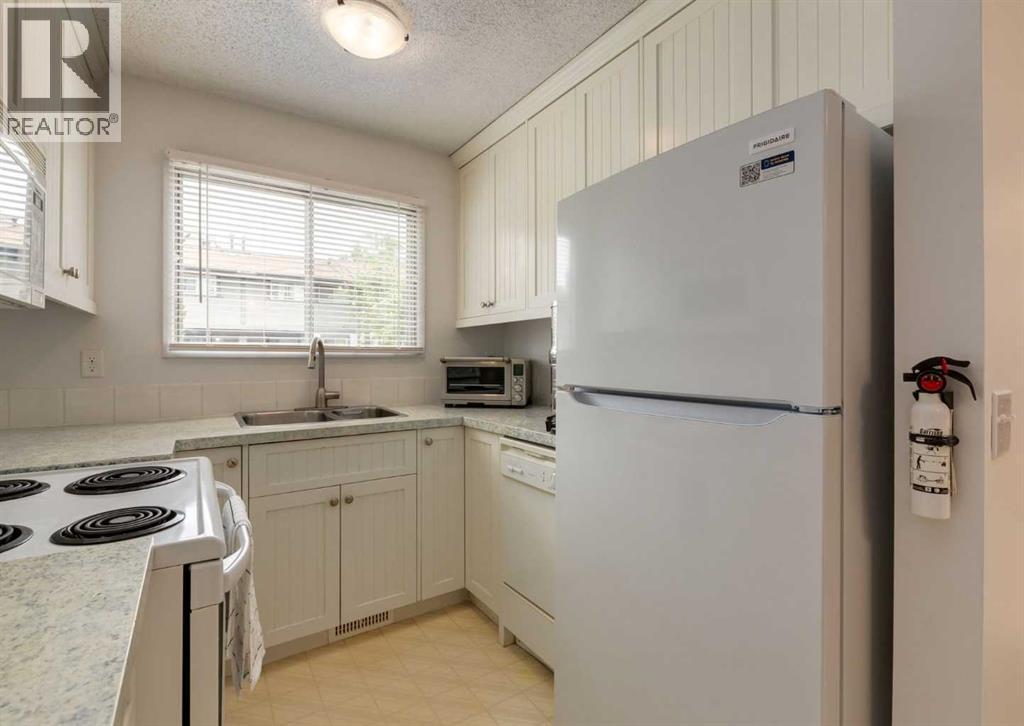 #122 7172 Coach Hill Road SW - 7