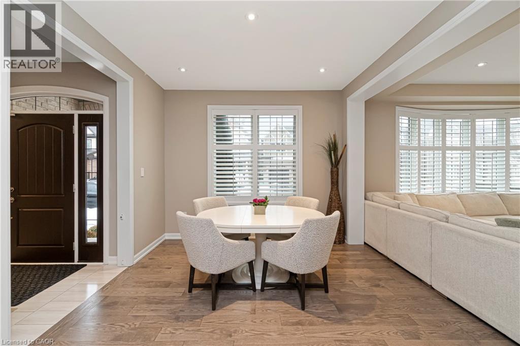 Bright interior space featuring wood-finish flooring and recessed lighting