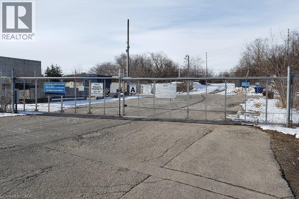 View of gate featuring fence