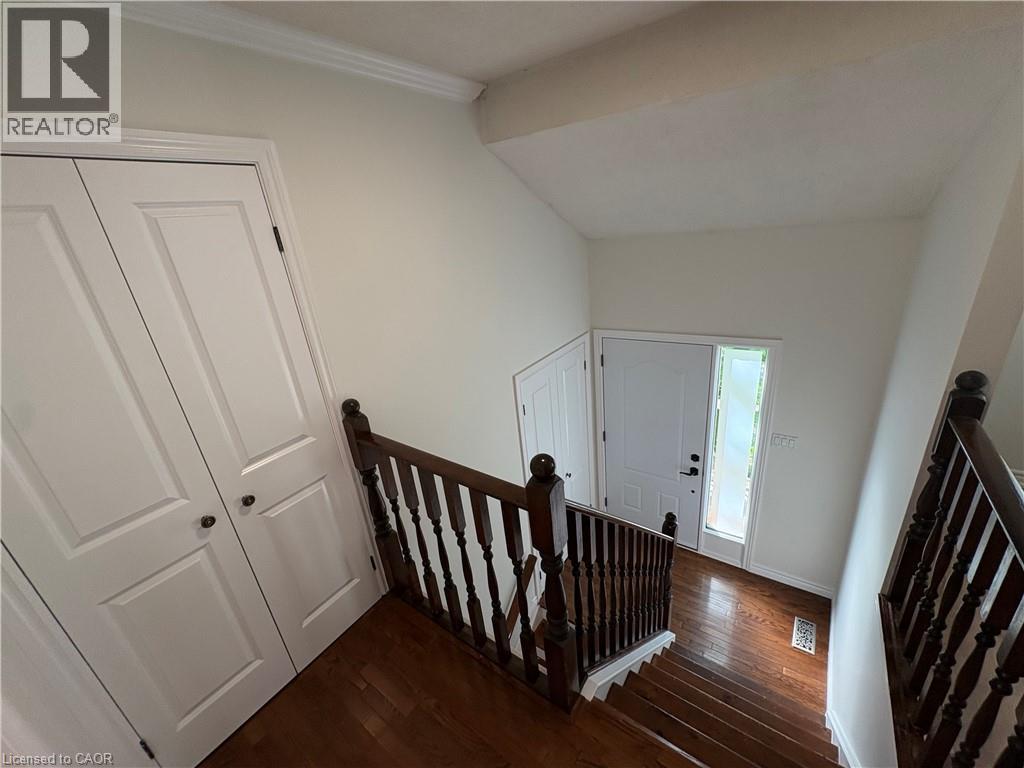 Hardwood flooring throughout staircase and entryway