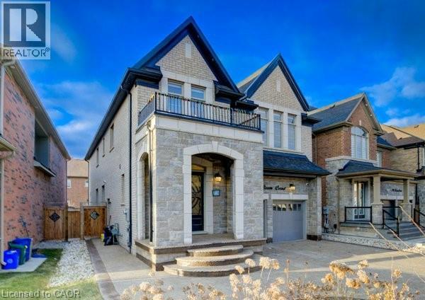 Stone and brick facade with contrasting dark gables