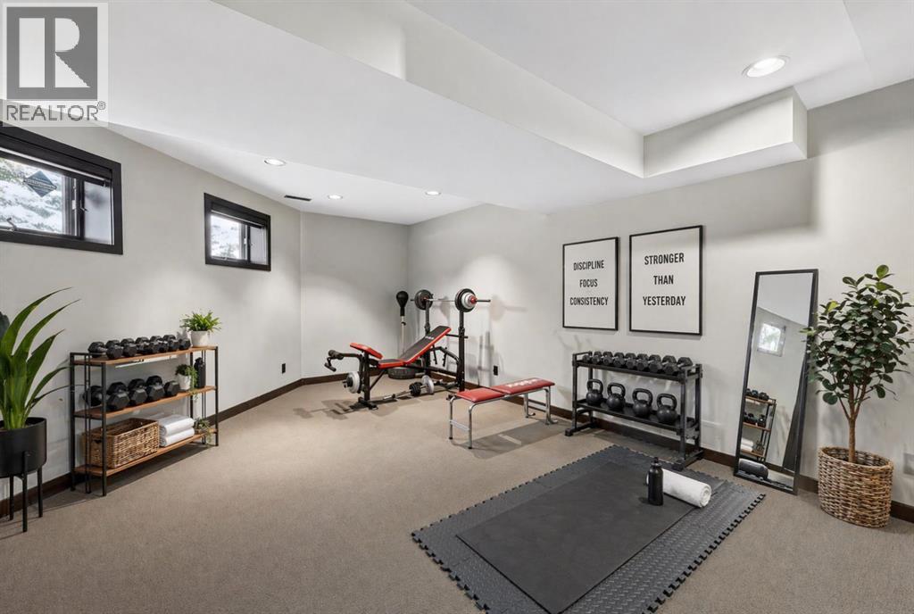Lower level gym area. This image has been digitally staged/altered
