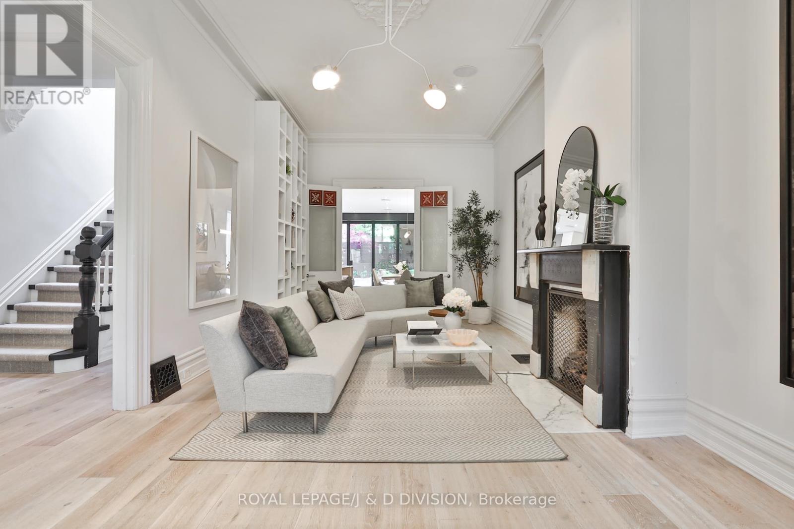 Separate living room, floor to ceiling bookcase