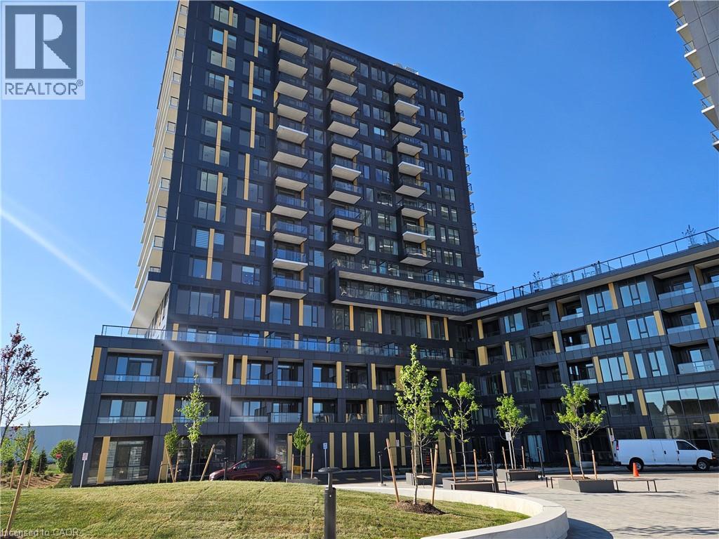 Contemporary high-rise building featuring a dark facade with contrasting vertical accents