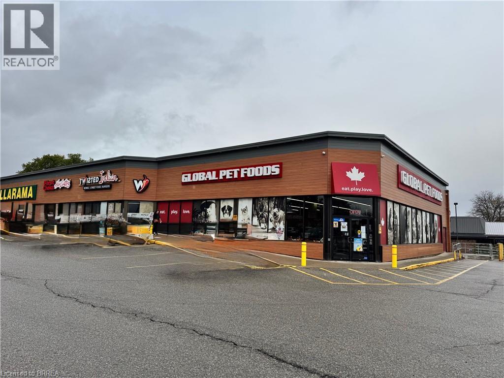 View of commercial location with uncovered parking