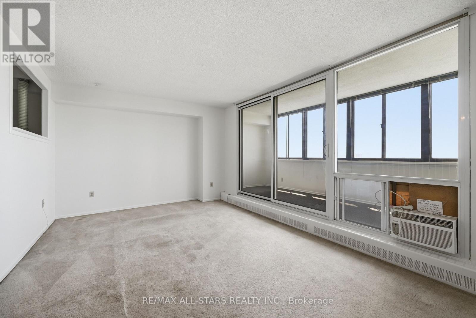 Spacious living room w adjoining sun room