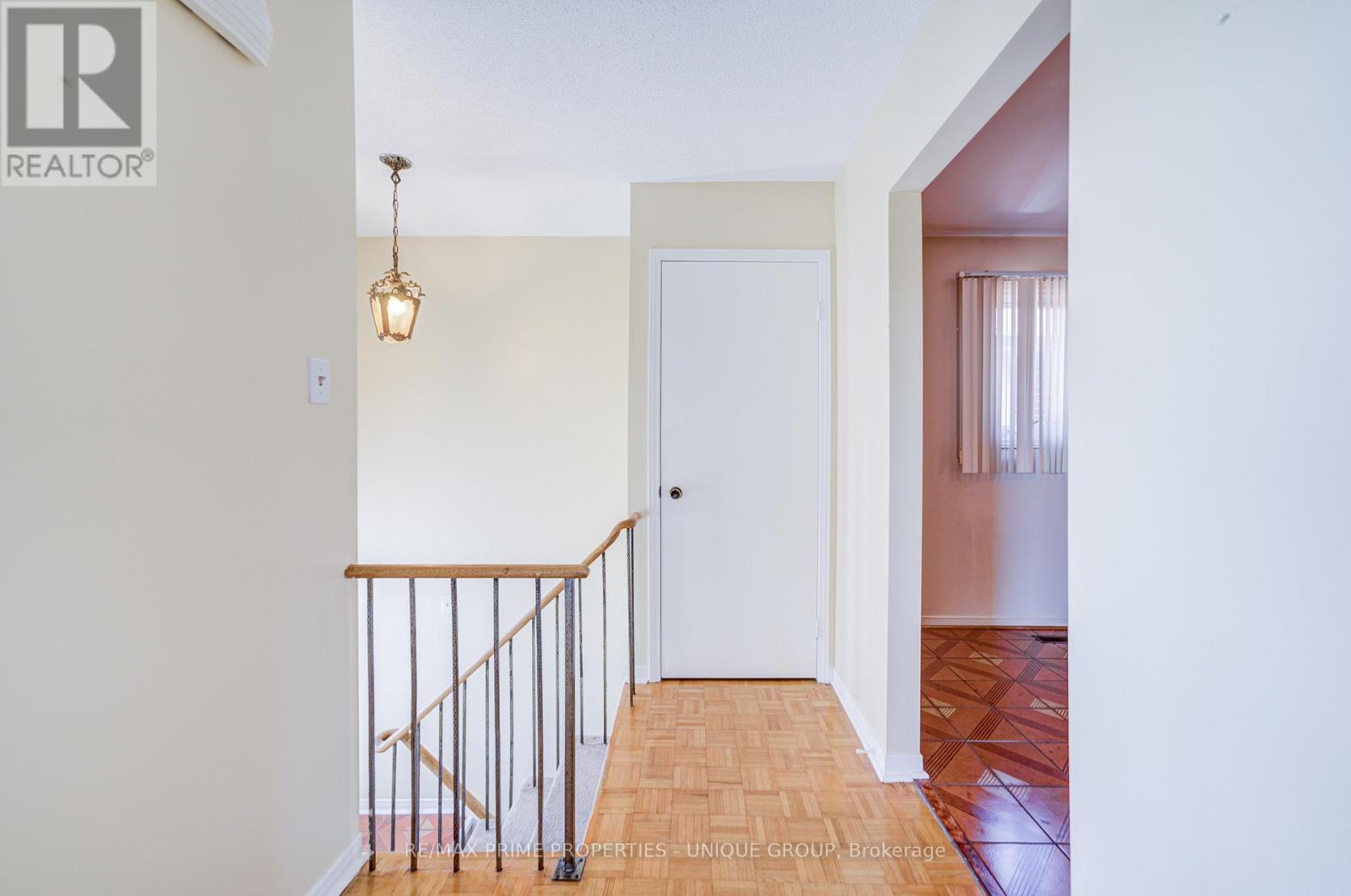 Upper level landing with receiving closet.
