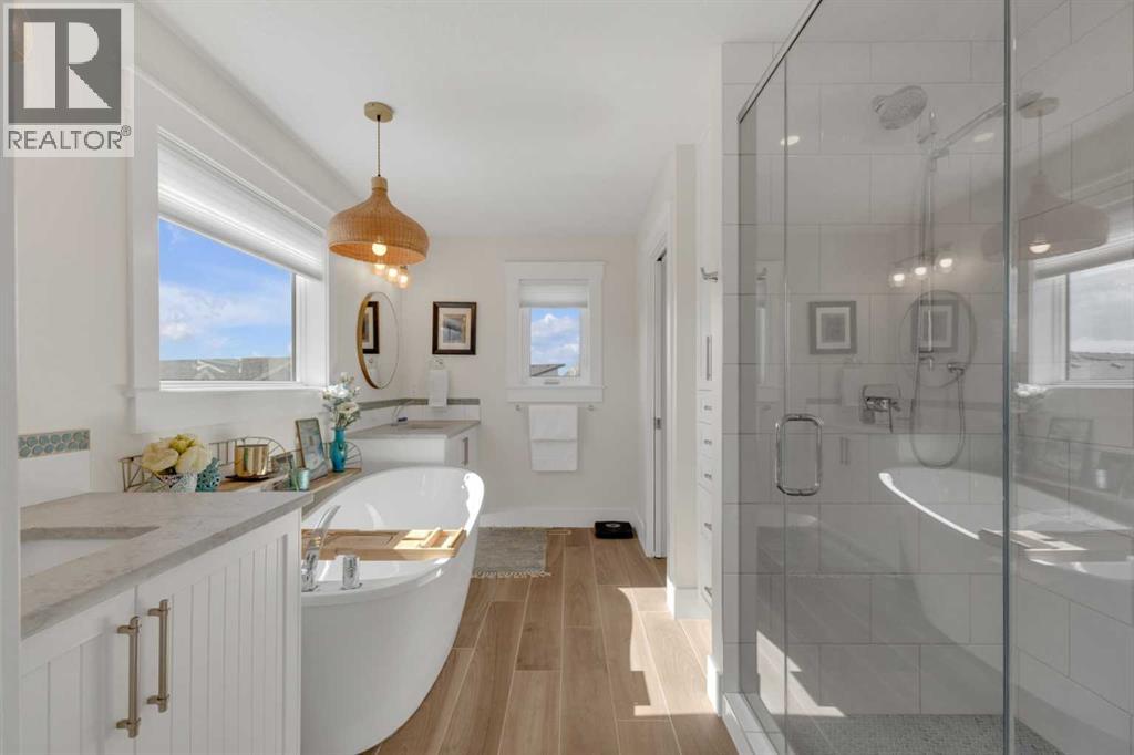 A bright, well-designed ensuite featuring soaker tub and separate glass shower