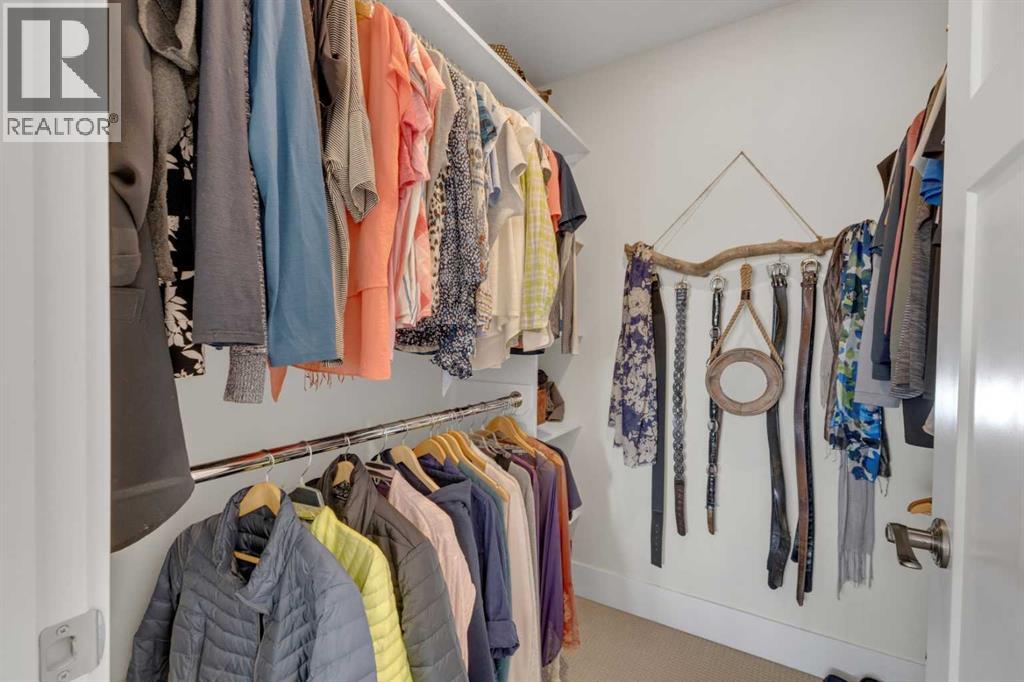 A well-organized walk-in closet with plenty of room to keep everything in its place