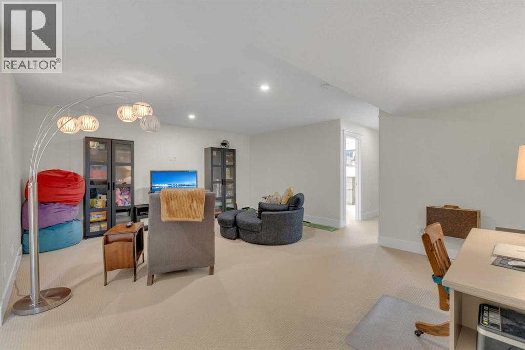 Expansive lower-level living area with plenty of room for relaxing, games or movie night - and in-floor heat too!