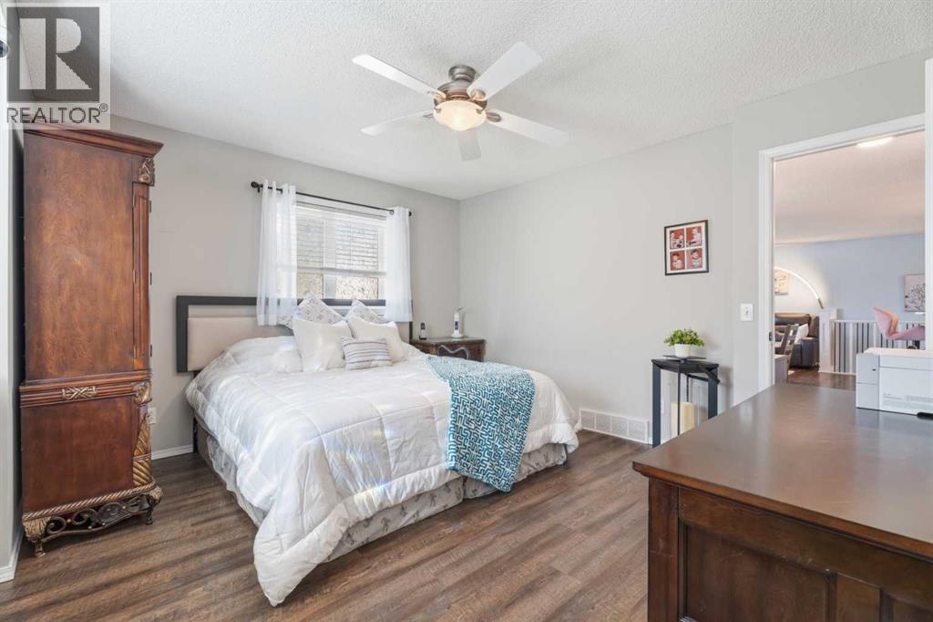 Primary bedroom with door to living area