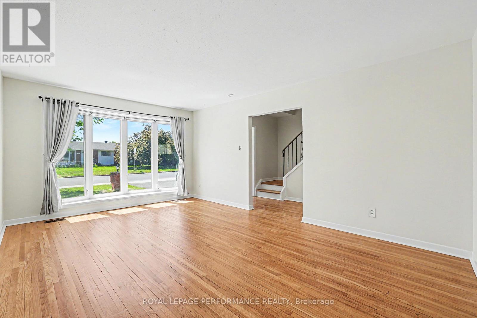 Spacious living room with large windows