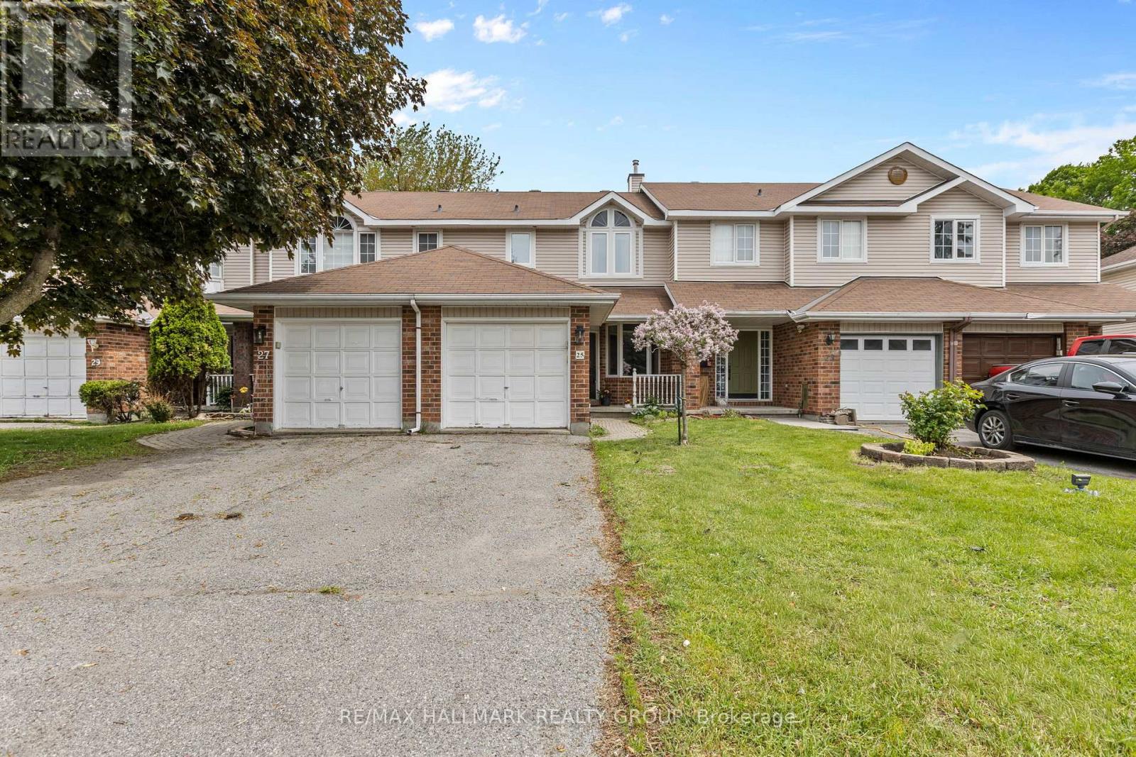 25 Oriska Way front view with garage & driveway