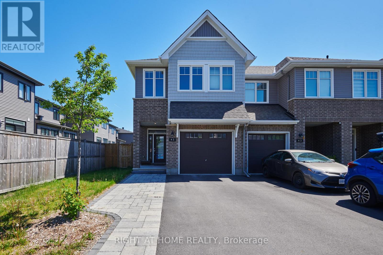Beautiful End Unit with extra parking pad!