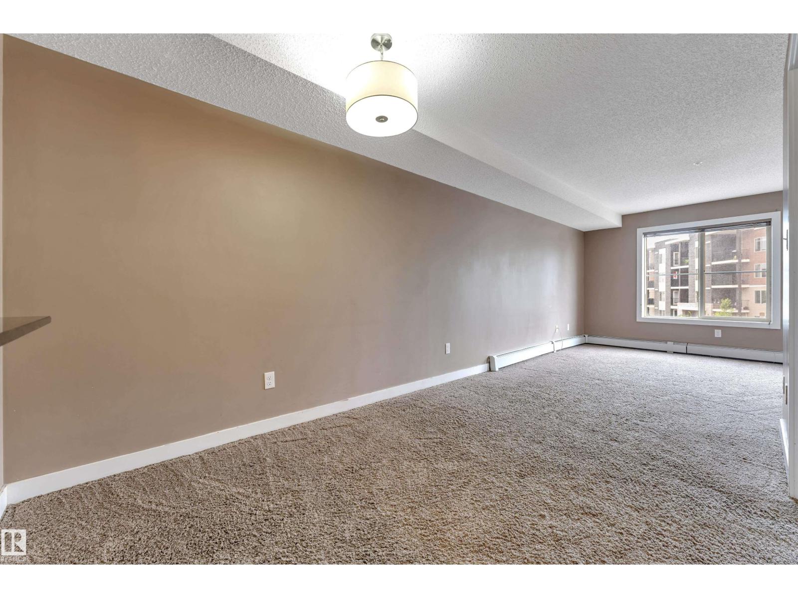 #209 11812 22 AV SW SW - 2