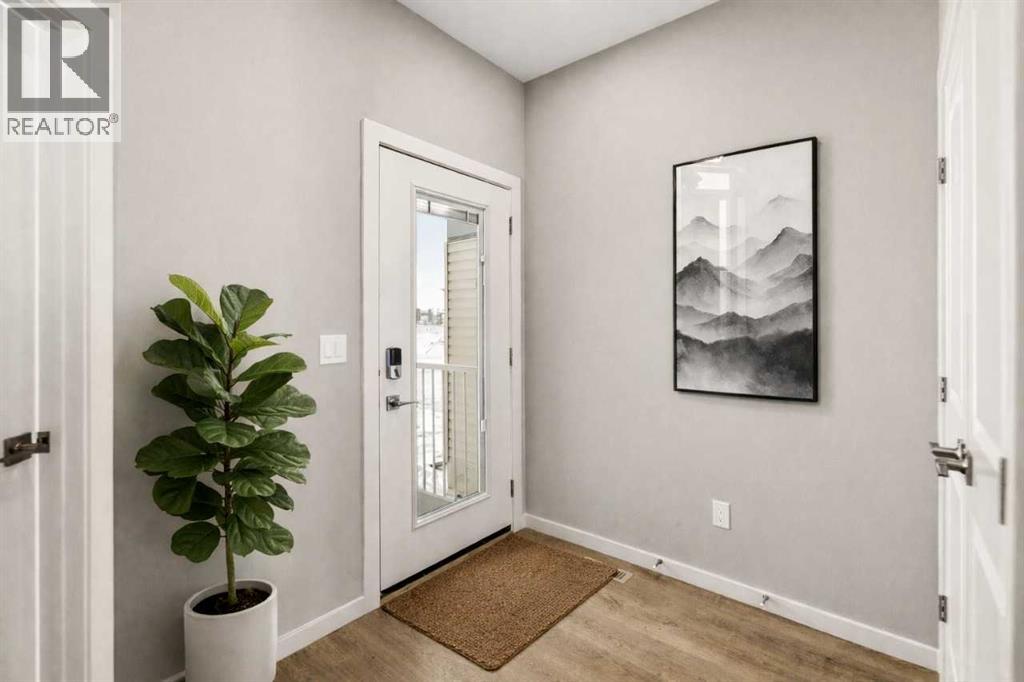 Front entry virtually staged for illustration purposes. Furniture and decor not included
