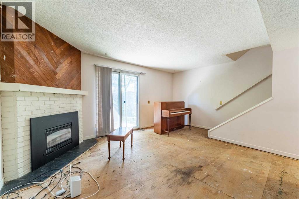 Fireplace, patio doors to large backyard