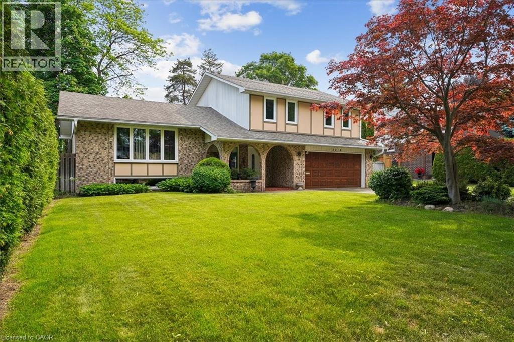 Brick and siding exterior with a large front lawn