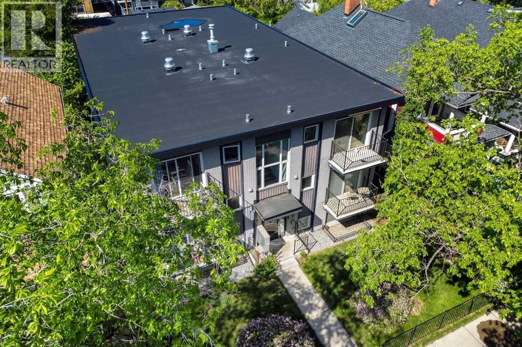 This condo is home to twelve, lucky units on a street where detached homes surround it. Please note the perfect, new roof!