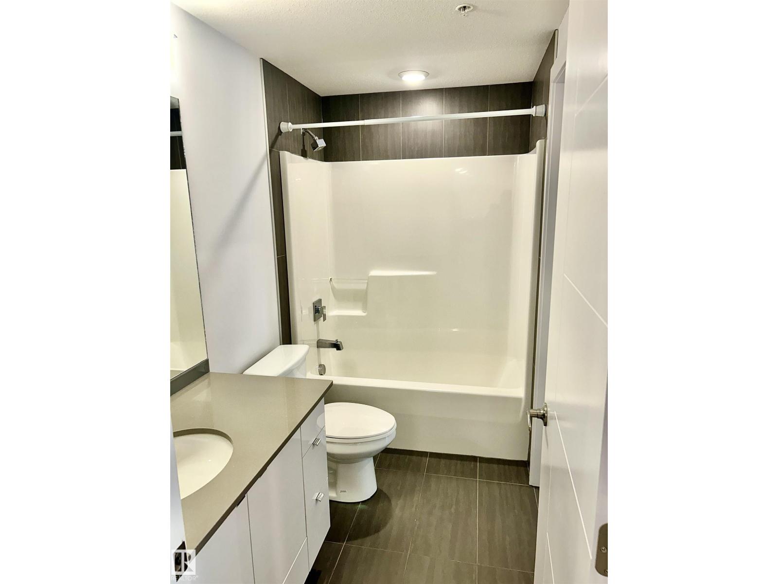 #203 8510 90 ST NW - 11
