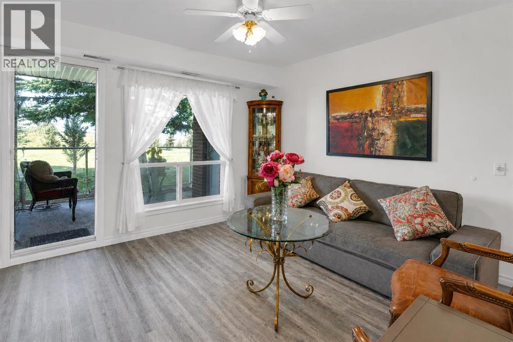 Living room with direct balcony access extends your living space outdoors, perfect for enjoying the peaceful green space views
